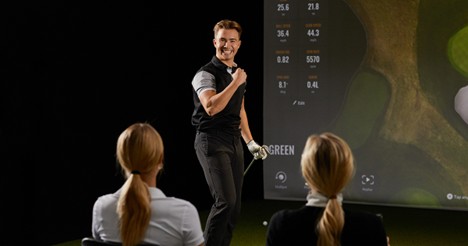 Group enjoying simulator golf